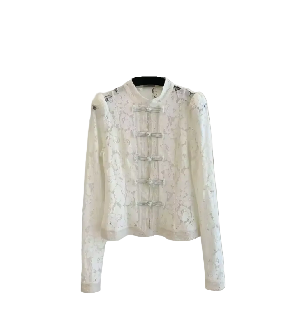 An off-white lace long-sleeve top with traditional Chinese frog closures, displayed on a black hanger stand against a white wall.