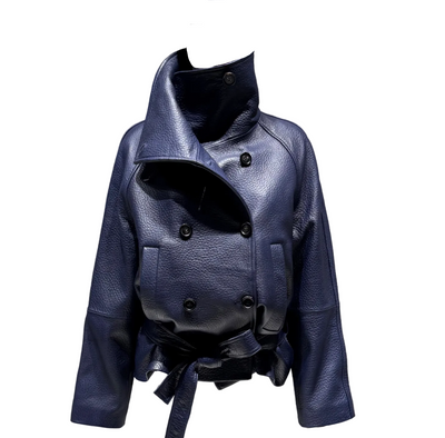 A dark navy blue textured leather jacket with a high collar and asymmetrical double-breasted buttons, displayed on a white mannequin against a gray concrete wall.