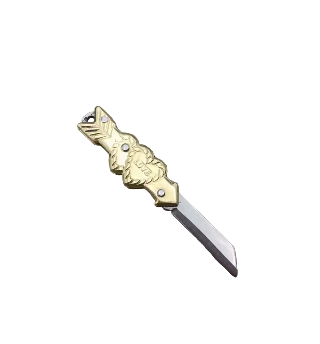 A miniature folding pocket knife with a gold-toned wolf head handle and a silver blade, shown next to a small silver key ring on a rustic wooden surface.