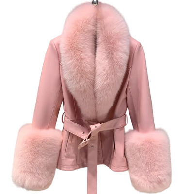 A pink faux-leather belted coat with a large fluffy pink fur collar and matching faux-fur cuffs, hanging against a gray textured wall.